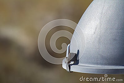 Part of a hemispherical street lamp with a metal cramp Stock Photo