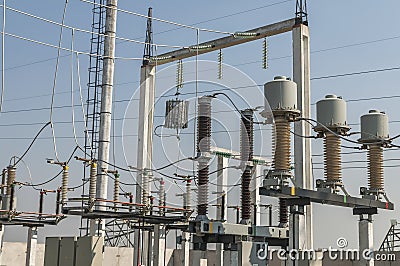 Part of high-voltage substation on blue sky background with switches and disconnectors. Ukrainian energy infrastructure Stock Photo