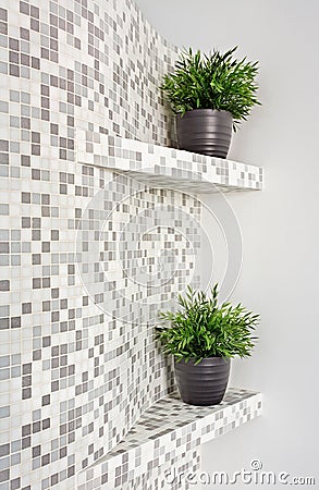 Part of interior with mosaic and green plants Stock Photo