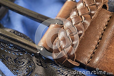 Part of leather belt with stitching. Men`s belt. Leather belt with metallic clasp. Clothes accessory. Trendy clothes accessories. Stock Photo