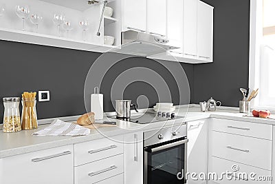 Part of modern kitchen with electric stove oven details and drawers Stock Photo