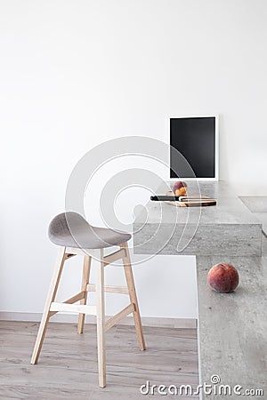 Part of modern scandinavian style kitchen: bar counter with bar counter and peaches. Stock Photo