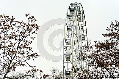 Part of modern white Ferris wheel and grey sky Stock Photo