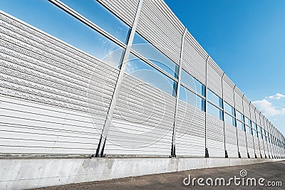 New highway with noise protection fence along Stock Photo