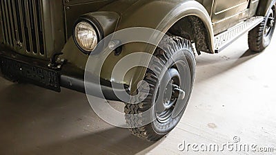 Part of the old soviet army car jeep. Restored retro car. Close-up Editorial Stock Photo