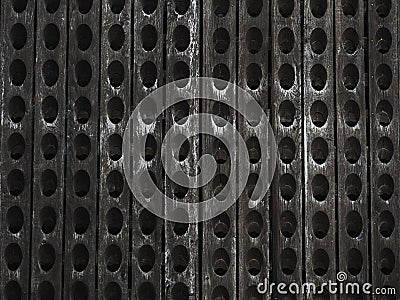 part of an old wine rack - wooden background with holes Stock Photo
