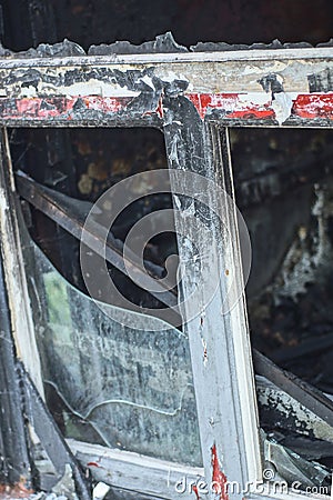 part of one burnt metal-plastic white black window frame Stock Photo