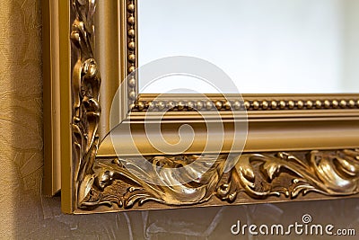 Part of the ornate, golden color carved mirror frame in ancient Stock Photo