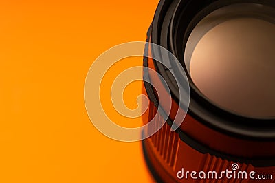 Part of photo lens on orange background Stock Photo