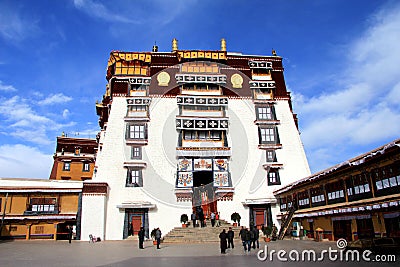 The part of the Potala Palace, with the people republic of China flag inside as well as many windows, curtain, Brick wall, Potala Editorial Stock Photo