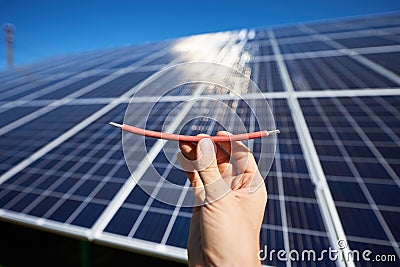 Part of red wires needing by solar panels installing. Stock Photo