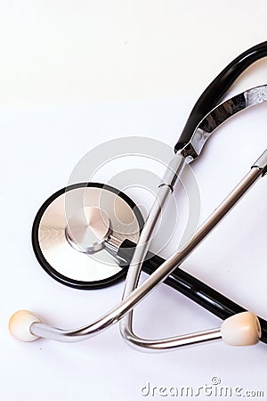 Part of a stethoscope on a blue background, copy space Stock Photo