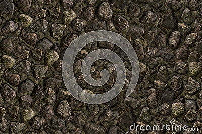 Part stone wall, many weathered gray stones covered with green moss. texture bottom old riverbed Stock Photo