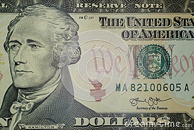 Part of the ten-dollar bill of the United States. Hamilton portrait. Macro. Close-up, high detail. Financial background. Green Stock Photo