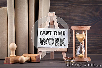 Part time work. Sandglass, hourglass or egg timer on wooden table Stock Photo