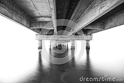 part under the Vasco da Gama bridge in perspective of infinity with the supporting pillars visible. Stock Photo