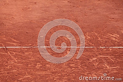 Part of an unpaved tennis court with traces of players` sneakers and a marking line. Can be used as background Stock Photo