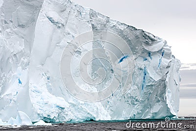 Part of very huge iceberg with escarpment in Arctic water Stock Photo