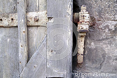 Part of a very old window shutter with flaky paint and rust Stock Photo