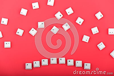 Keyboard keys. Word `pandemic` made from keys isolated. White keyboard keys on red background. Top view. Close up Stock Photo