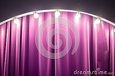Part of the zone on the stage, decorated with lamps. Purple backstage, bright lighting Stock Photo