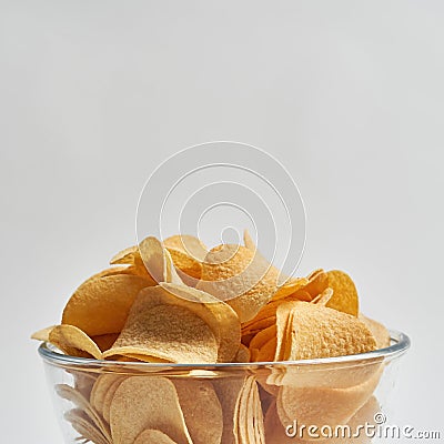 Partial bowl of delicious heap of potato chips Stock Photo