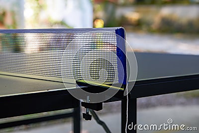 Partial close-up of the net of a ping pong table Stock Photo