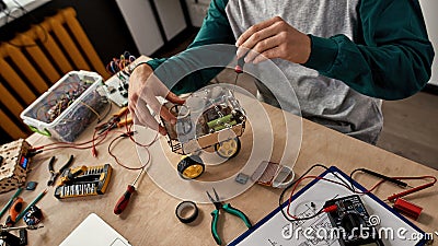 Partial IT engineer fixing automated wheel robot Stock Photo