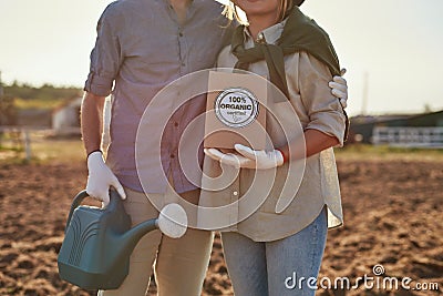 Partial of farmer couple with water can and seeds Stock Photo