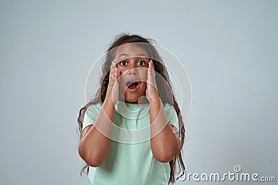 Partial of frightened little girl with open mouth Stock Photo