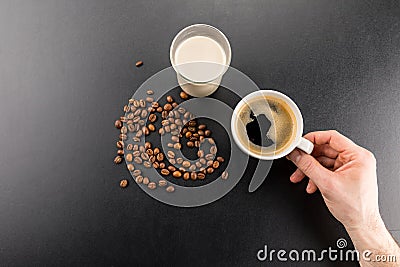 Partial top view of person holding cup of fresh espresso coffee Stock Photo