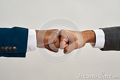 Partial of two multiracial businessmen fist bumps Stock Photo
