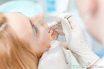 Partial view of blonde woman at dental check up Stock Photo