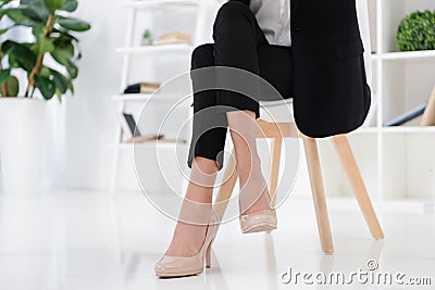 partial view of businesswoman sitting at workplace Stock Photo