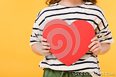 partial view of kid with red paper heart in hands Stock Photo