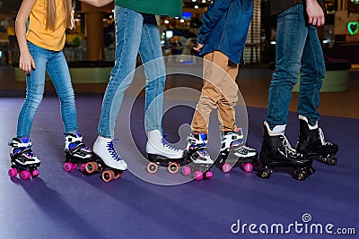 partial view of parents and kids skating on roller Stock Photo