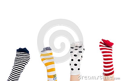 Partial view of people with colorful sock puppets on hands Isolated On White with copy space. Stock Photo