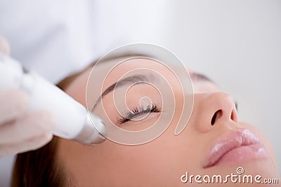 partial view of woman getting facial treatment Stock Photo