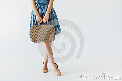 partial view of woman holding retro suitcase Stock Photo