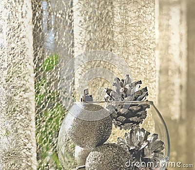 Partially blurred view with low sharpness transparent vase with silver cones and balls minimalistic christmas concept, filter Stock Photo