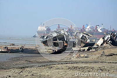 partially broken down ocean ships at a shipbreaking yard. Inside of ship breaking yard Editorial Stock Photo
