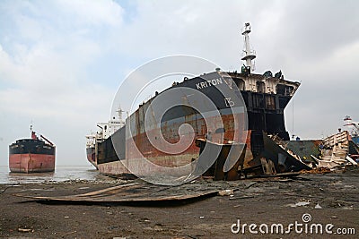 partially broken down ocean ships at a shipbreaking yard. Inside of ship breaking yard Editorial Stock Photo