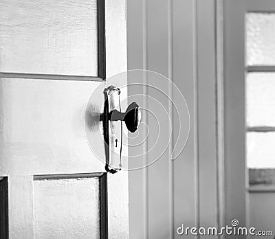 Partially opened vintage interior door - concept behind closed doors Stock Photo