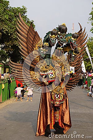 The participant Biro Fashion Carnival with dragon costume Editorial Stock Photo