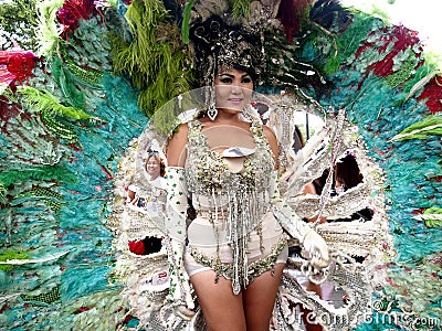 A participant in her colorful costume at a parade during the Sumaka Festival in Antipolo City. Editorial Stock Photo