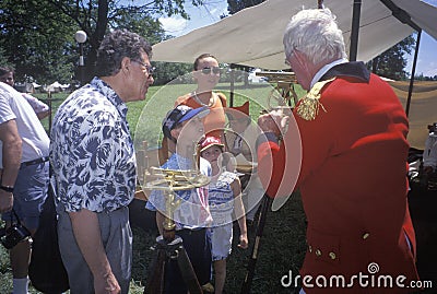 Participant with students during Historic Revolutionary War reenactment of Battle of Monmouth, Freehold, NJ Editorial Stock Photo