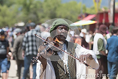 Participant wearing vintage clothes, playing violin Editorial Stock Photo
