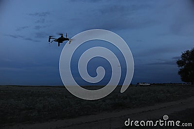 Almaty, Kazakhstan - 06.29.2013 : Silhouette of a drone for playing airsoft at night Editorial Stock Photo