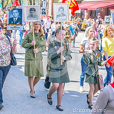 Participants in the column `Immortal Regiment` with portraits of relatives killed in World War II Editorial Stock Photo