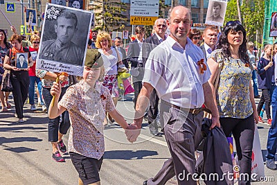 Participants of the column `Immortal Regiment` with portraits of relatives killed in World War II Editorial Stock Photo